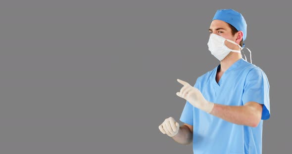 Surgeon pretending to be using futuristic digital screen