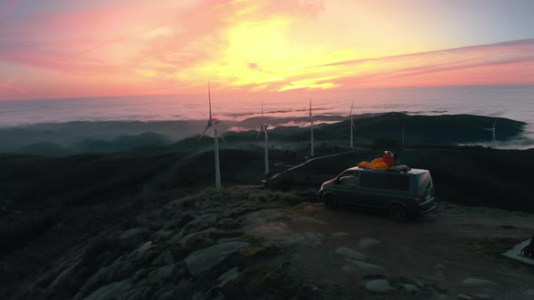 Cinematic Couple Lay on Top of Camping Van