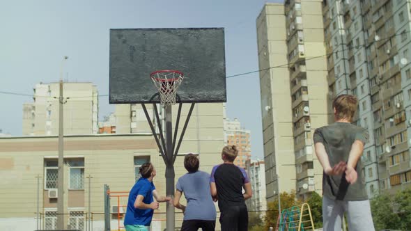 Streetball Players Figthing for Rebound on Court