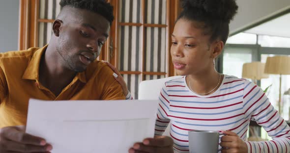 Video of focused african american couple planning home budget