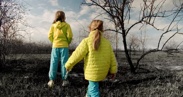 The Younger Sisters Dressed in the Colors of the Ukrainian Flag Embrace