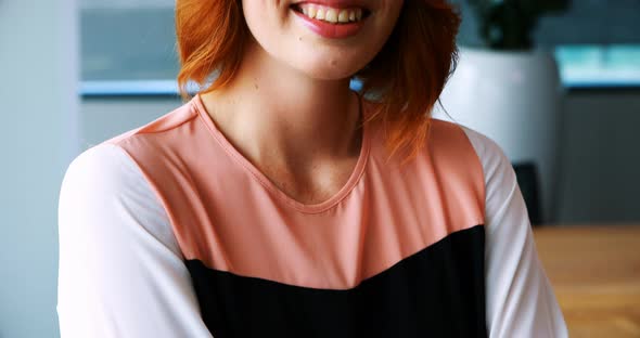 Smiling female executive in office