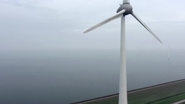 Rising Aerial View of a Giant Wind Farm Used for Renewable Energy
