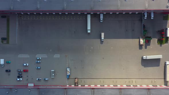 Aerial view of goods warehouse. Logistics center in industrial city zone from above. Aerial view of