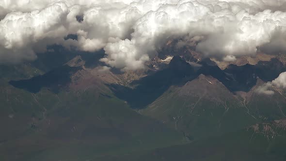 Long Valley Landscape Above Clouds From Airplane Window 