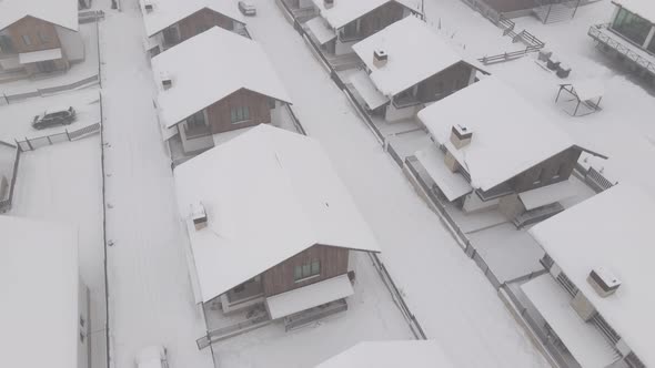 Flying over mountain resort Crystal in Bakuriani, Snowy winter day, Georgia