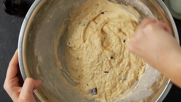 Female Hands Making Batter with Chocolate in Bowl