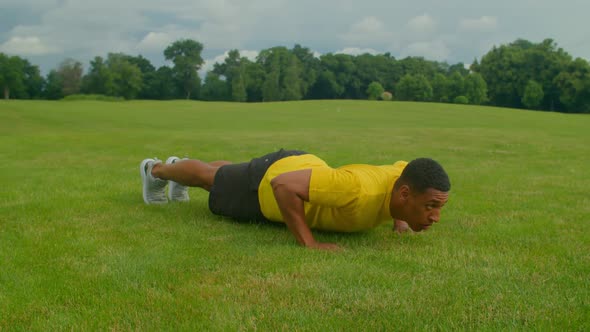 Muscular Build Fitness Black Man Working Out Press Up Exercise Outdoors