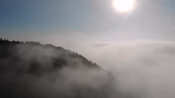 Flying Through the Foggy Clouds in Morning