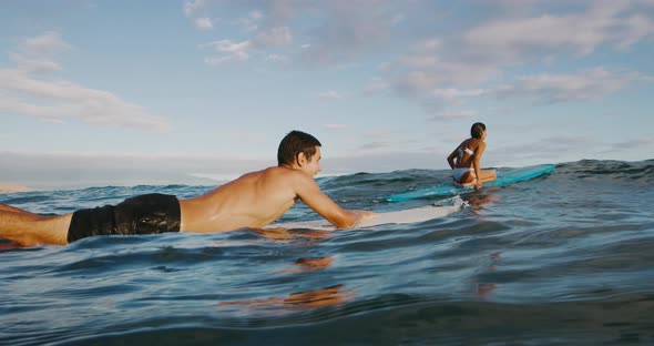 Paddling out to surf together