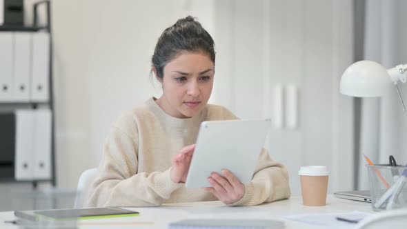 Indian Woman with Tablet Reacting to Loss