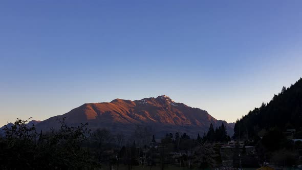 Day to Night Timelapse of Cecil's Peak mountain in the Wakatipu Basin. Lake Wakatipu in Queensland,