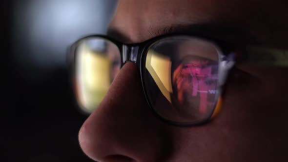 Man With Glasses Working At Night