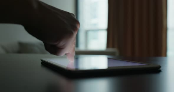 Use of tablet computer on the table