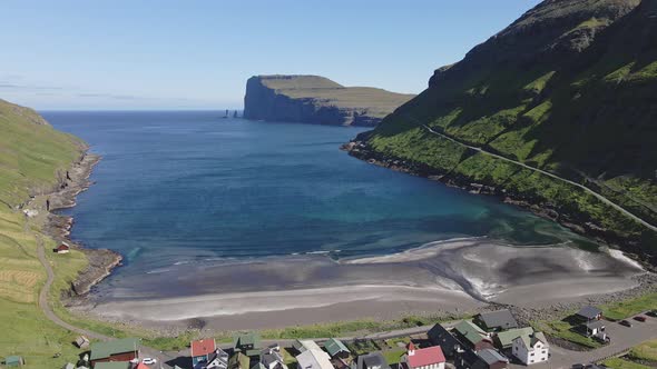 Aerial View of Endless Ocean Horizon and Nearby Village Faroe Islands