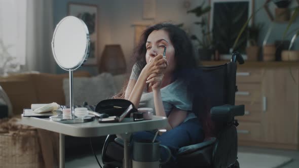 Woman in a Wheelchair Doing Makeup