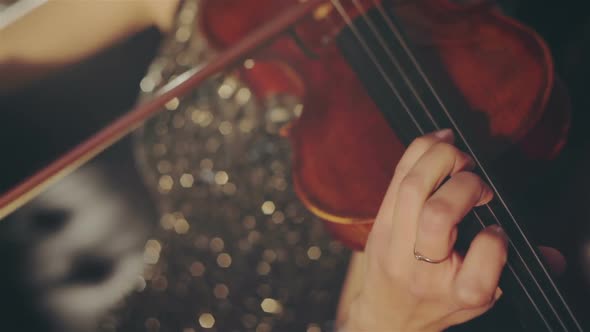 Woman in Evening Dress Playing the Violin