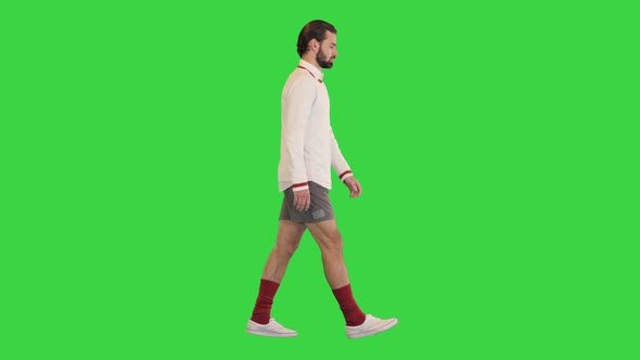 Handsome Male Tennis Player Walking on a Green Screen Chroma Key