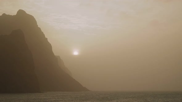 Amazing Silhouette of Huge Cliffs By Sunset in the Dust