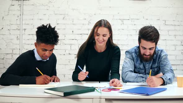 Happy Diverse Group of Students or Young Business Team Working on a Project