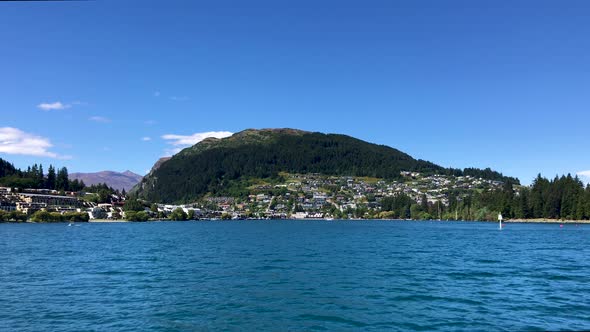 Wide shot of Queenstown Hill on beautiful sunny day. Lake Wakatipu, Queenstown, Otago, New Zealand