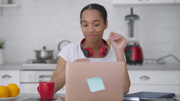 Young Cheerful Woman Sending Email Closing Laptop and Making Victory Gesture Smiling