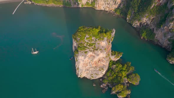 Separated Rock in the Sea Island As Limestone Cliff in the Blue Water Aerial