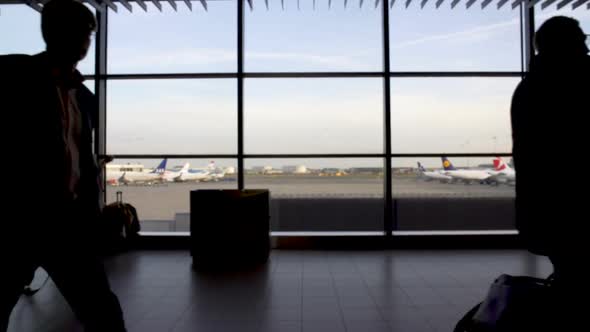 Silhouettes of Passengers Walking at Terminal Hall, Business Trip, Airport