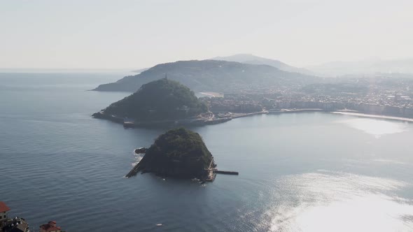 Majestic coastline of San Sebastian city in Spain, aerial cinematic view