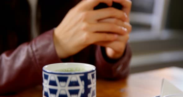 Woman Using Mobile Phone at Restaurant 4k