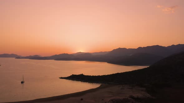 Beautiful Red Sunset Over the Sea and Mountains