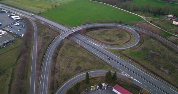 Aerial View of Highway Road Intersection with Fast Moving Heavy Traffic