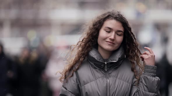 Loneliness in Crowd Young Woman Is Walking on Street of Big City with Many People Portrait