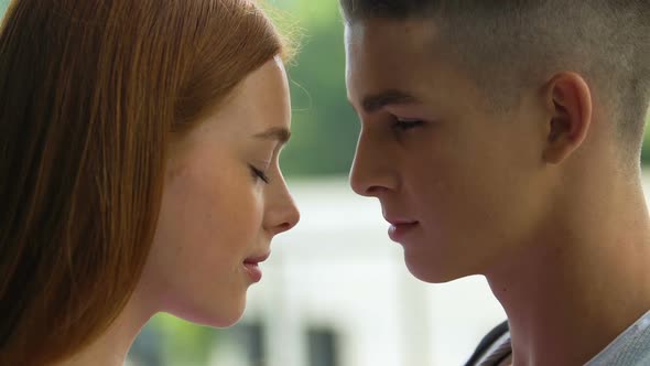 Young Teenage Couple Touching Foreheads, First Love and Tender Feelings, Romance