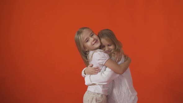 Two Little Girls Hugging