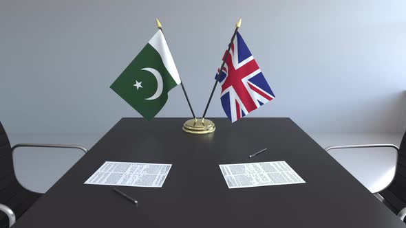 Flags of Pakistan and the United Kingdom and Papers