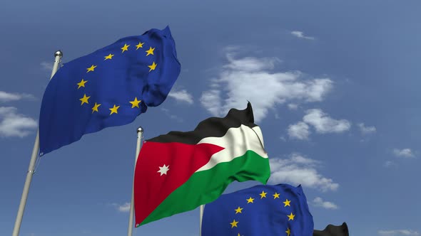 Waving Flags of Jordan and the EU on Sky Background