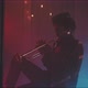 A musician playing the trumpet in a room with smoke and neon lights - VideoHive Item for Sale
