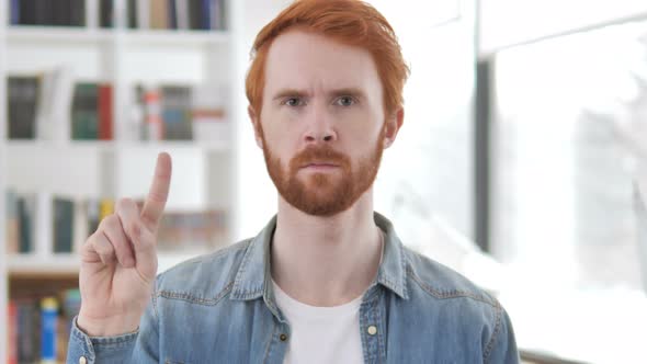 Casual Redhead Man Waving Finger To Reject