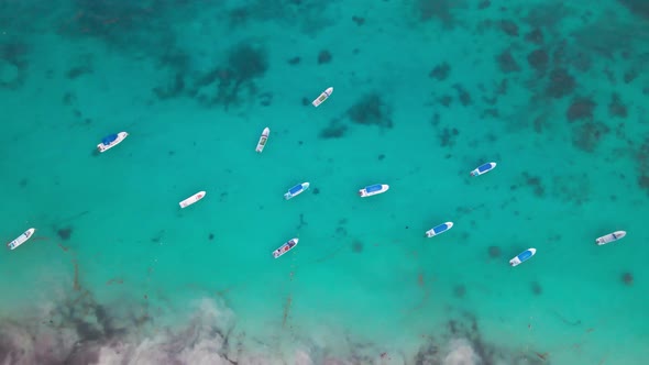 Top drone shot. Boats in the ocean. Tulum, Mexico.