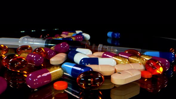 Macro View Of Colored Medicines Used For Healing And Needle 8