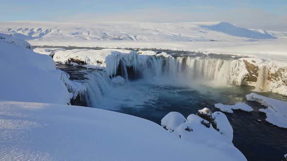 Sunlit Godafoss Waterfall and Skjalfandafljot River