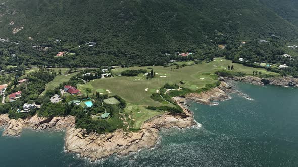 4K Aerial Drone shot of Huge Golf Course in Shek O near the sea, in Hong Kong