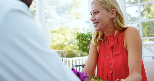 Couple interacting with each other in restaurant