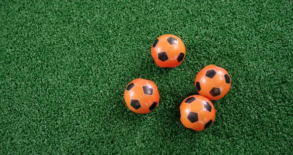 Footballs on artificial grass 4k