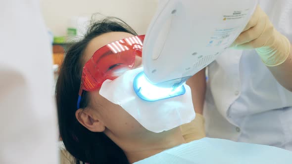 A Woman is Having an Oral Hygiene Procedure