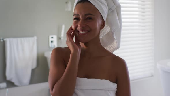 Portrait of african american woman smiling in the bathroom