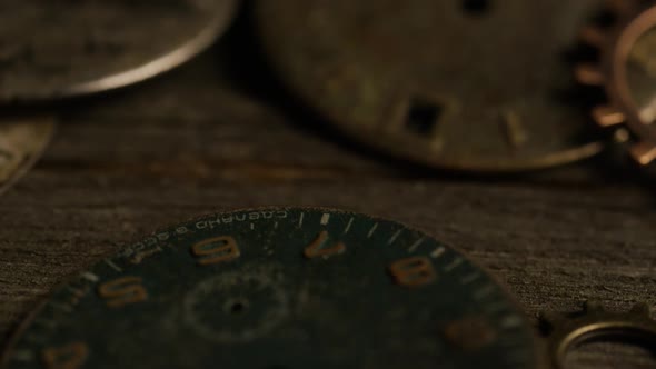 Rotating stock footage shot of antique and weathered watch faces 