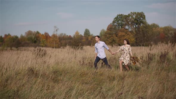 Couple in Love Walking and Holding Hands