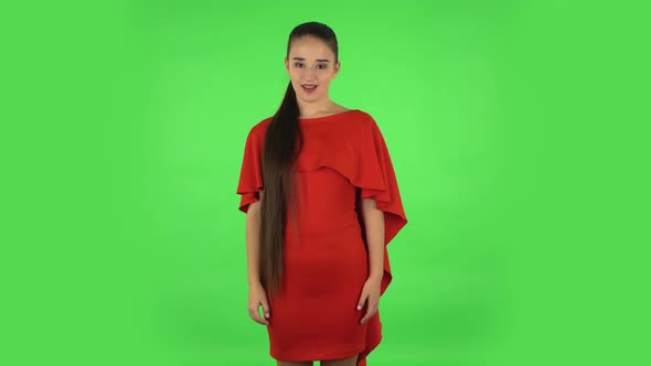 Pretty Young Woman Is Making Sign Ok. Green Screen